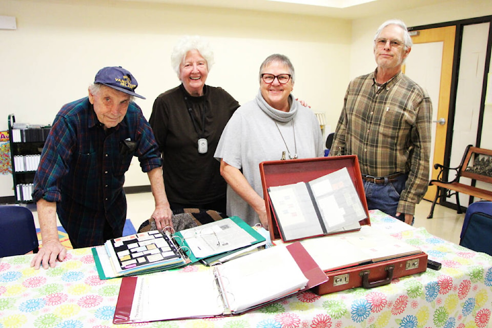 The 100 Mile and District Stamp Club includes Alan MacNaughton (left), Glenna Metchette, Georgia Johnson and George Wilby among their ranks. (Patrick Davies photo - 100 Mile Free Press)