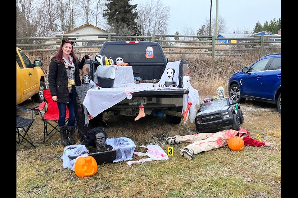 Sambrina Pratt, winner of the best-decorated vehicle with her Halloween accident scene. (Fiona Grisswell photo - 100 Mile Free Press)
