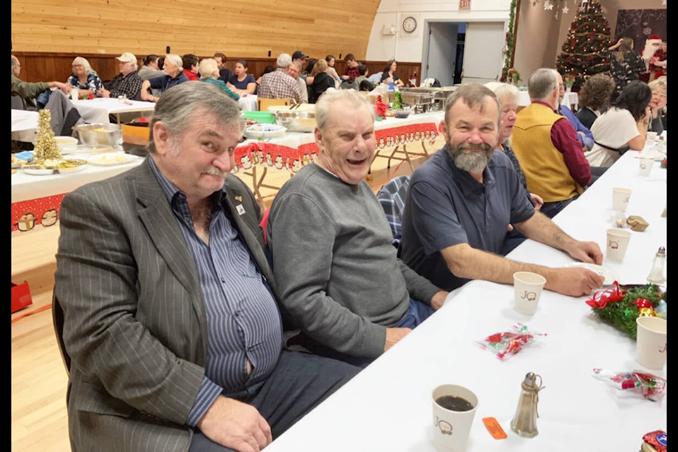 Friends and Cruzers Car club members Norbert Gruening (L), Mike Case and Dave Neale attended the Lone Butte, Horse Lake Community Christmas dinner with their families. (Fiona Grisswell photo - 100 Mile Free Press)