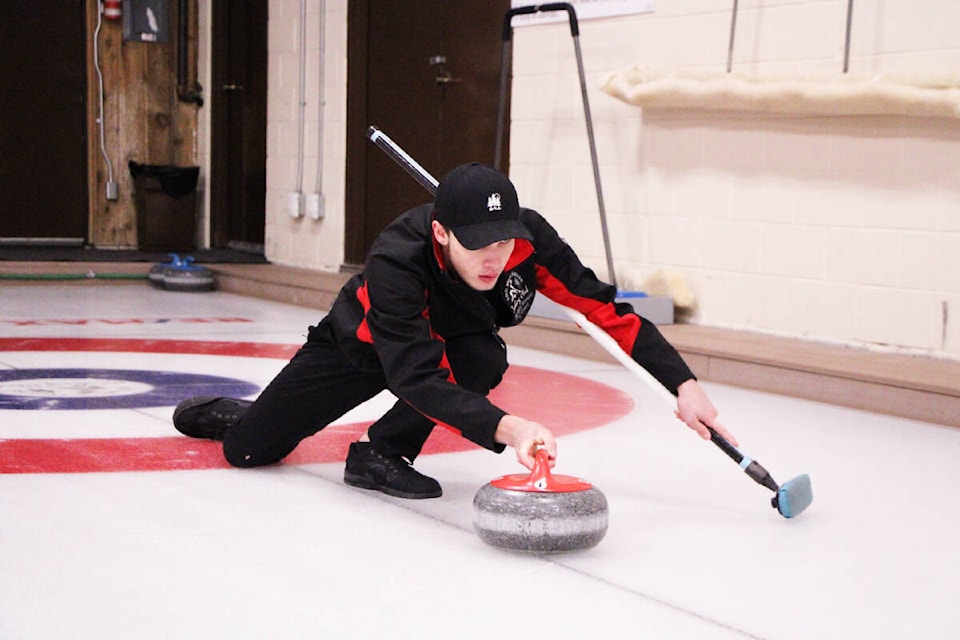 100 Mile Curling Club member Elyas Day makes a shot during this weekend’s doubles bonspiel. (Patrick Davies photo - 100 Mile Free Press)