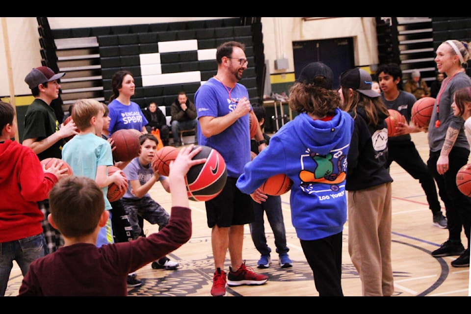 TJ Grabowiecki smiles as basketball players of all ages surround him during one of Engage Sport North’s basketball camps last Thursday. (Patrick Davies photo - 100 Mile Free Press)