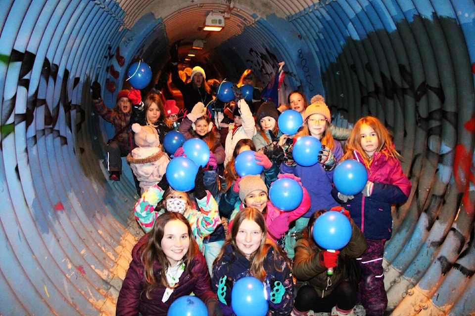The 100 Mile Girl Guides celebrated World Thinking Day in February by singing Thunderation, a classic guides camping song, in the tunnel beneath Highway 97. World Thinking Day is held to remember the founders of the Girl Guides organization Lord Robert Baden-Powell and his sister Lady Agnes Baden-Powell. (Patrick Davies photo - 100 Mile Free Press)