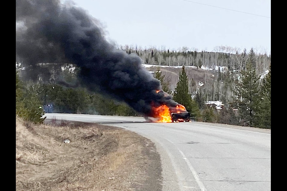 A truck burns on Canim-Hendrix Road on Friday, March 31 after catching fire. (Martina Dopf photo)
