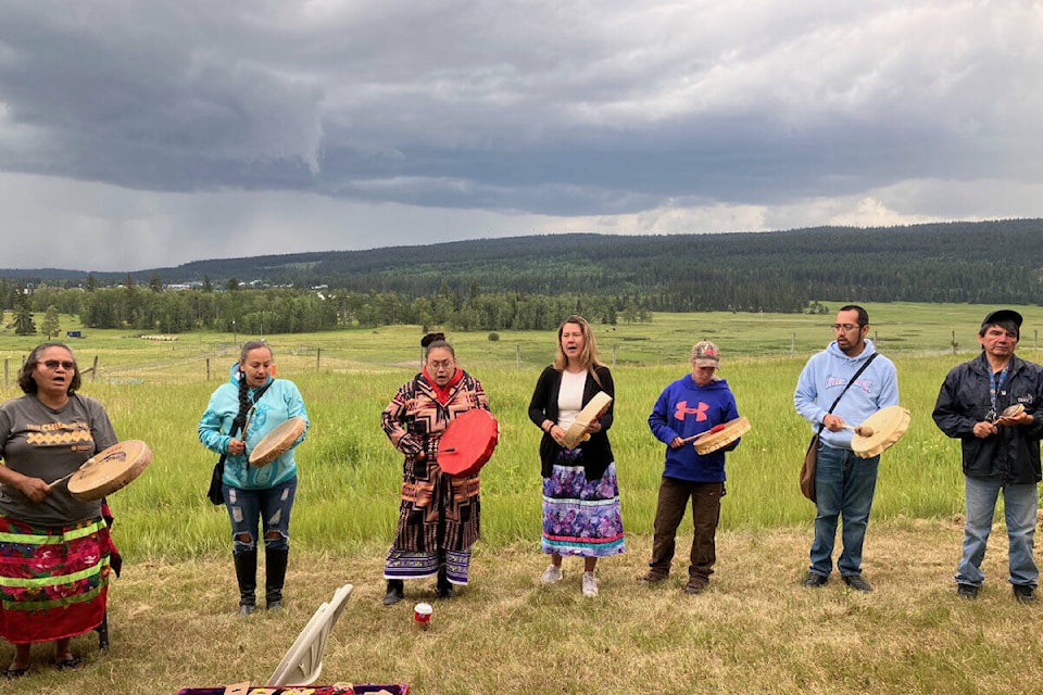 From left: Lenore Christopher, April Truran, Lydia Dick, Laurelee Bennett, Angela Dussault, Joseph Archie and Melvin Paul drumming and singing at the Indigenous People’s Day celebration on June 21. (Fiona Grisswell photo - 100 Mile Free Press)