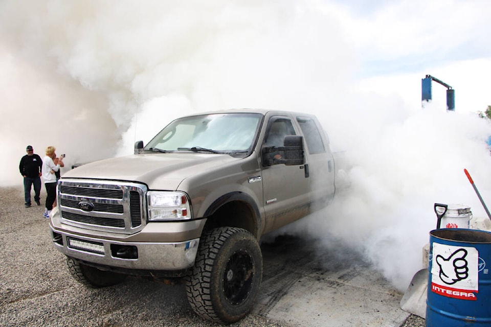 A Ford Truck does a burnout at MDA Fabrication’s grand opening on Saturday, June 24. (Patrick Davies photo - 100 Mile Free Press)