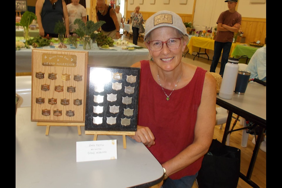 The 2022 Bridge Lake Fair grand aggregate winner Barb Matfin, with plaques dating back to 2000. (Diana Forester photo)