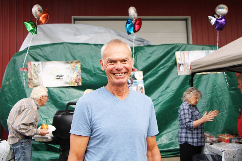 100 Mile Ranch and Feed Supply owner Dan Kay was running around on Friday, Aug. 25 to find burger and hot dogs for his customers during their annual customer appreciation barbeque. (Patrick Davies photo - 100 Mile Free Press)