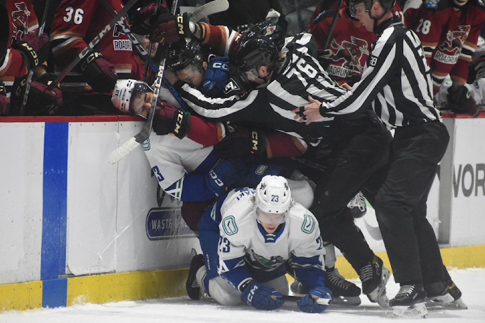 Abbotsford's Arshdeep Bains gets roughed up after the whistle. 