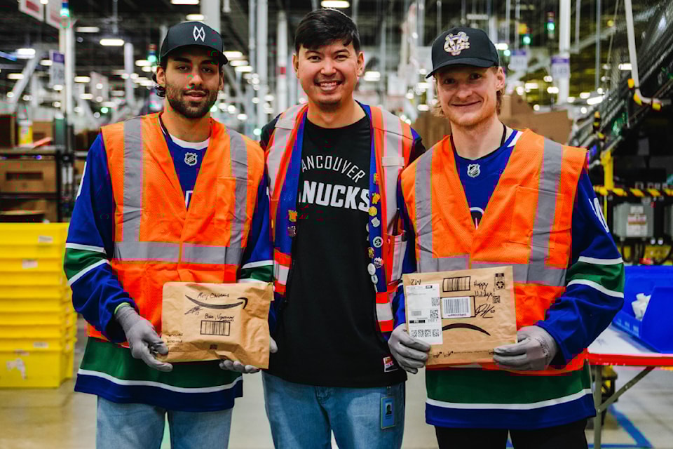Canucks players Arshdeep Bains (left) and Danton Heinen (right) made a special visit to Amazon's YXX2 fulfillment centre in Richmond on Wednesday (Dec. 11). 
