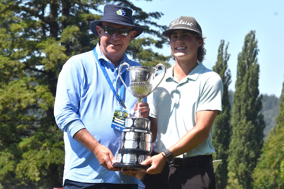 Cooper Humphreys receives the B.C. Amateur trophy.