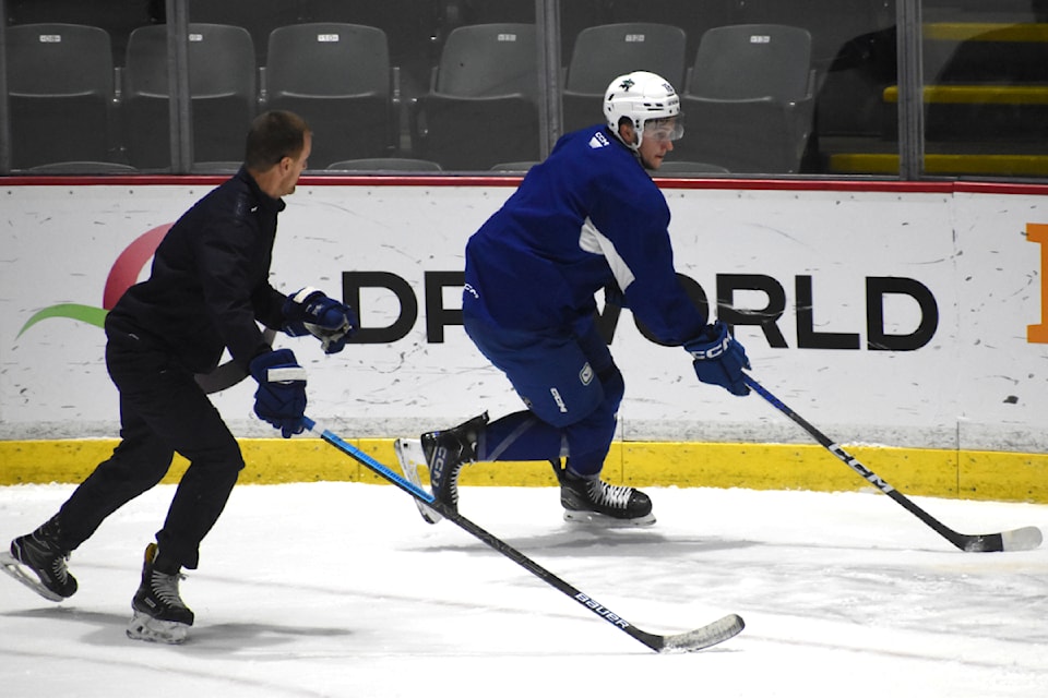 Danila Klimovich works with Henrik Sedin. 