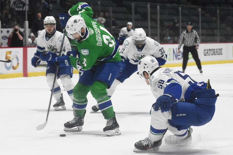Phil Di Giuseppe dekes around the opposition. 