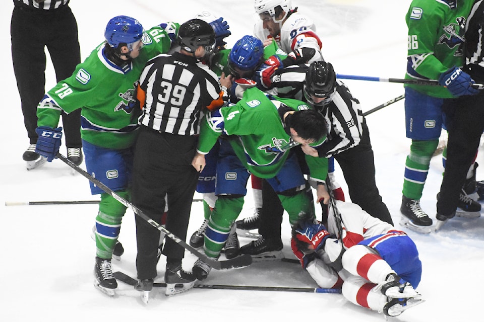 Abbotsford's Jett Woo goes after Laval's Xavier Simoneau following a scrum.