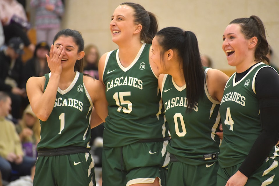 (left to right) Google Sidhu, Deanna Tuchscherer, Nikki Cabuco and Maddy Gobeil laugh during the seniors night tribute video. 