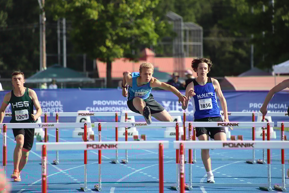 Abbotsford Christian's Marcus Brandsma (centre) competed at the 2025 Track and Field Provincial Championships in Langley.