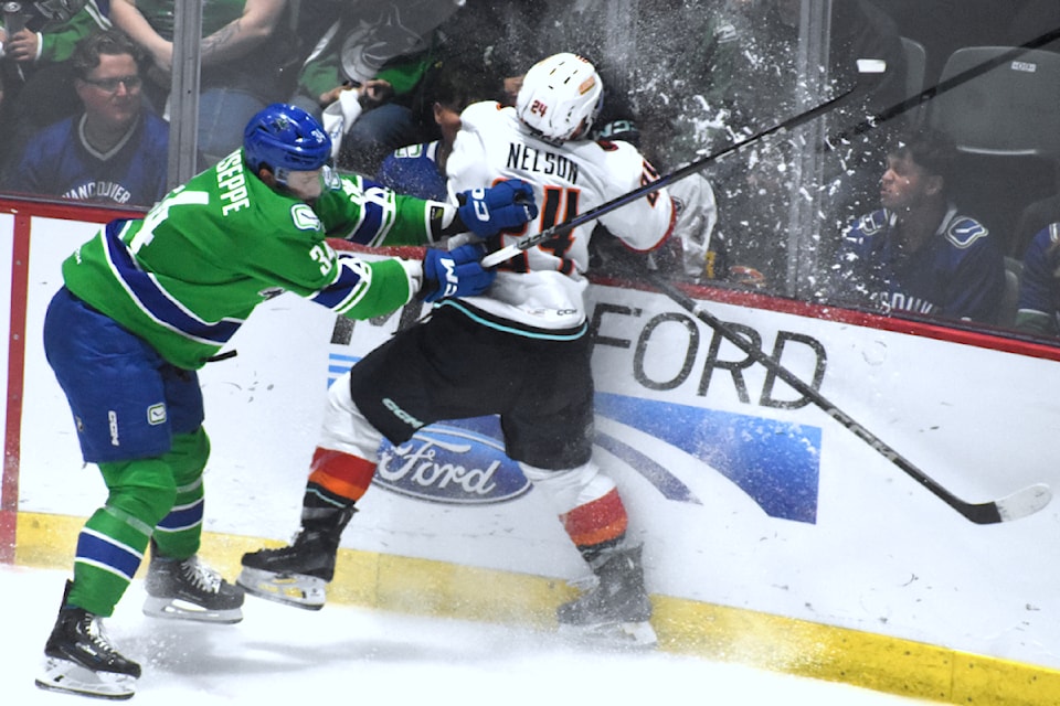 Phil Di Giuseppe clobbers a Firebirds player. 