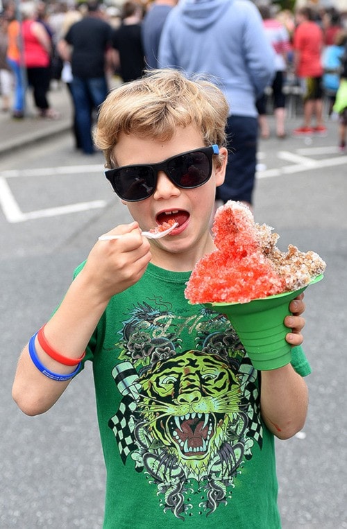 7 year old Michael enjoys shaved ice cone during Berrybeat