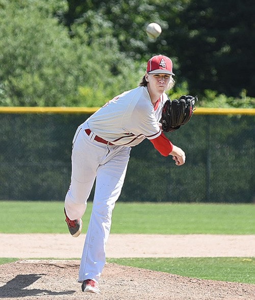 Jr. Card's piture no. 28 delivers against Coquitlam red legs on Sunday.