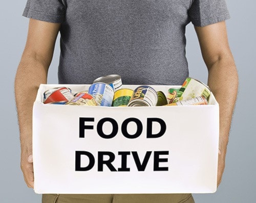 Man holding food drive box