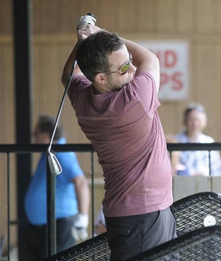 Marty Peters watches as his ball flies toward pin in Million Dollar Hole in One