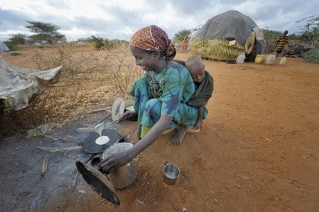 Woman cooks in Kenya refugee camp