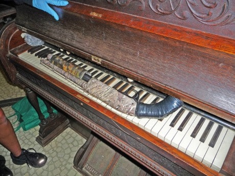 Shot Gun found on keyboard of piano