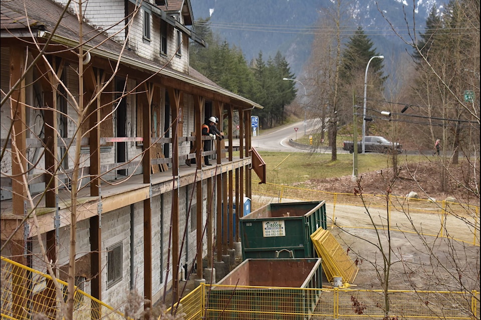 Construction workers throw a table down from the Hope Station House as they worked to clear the structure out early Friday morning. The work was halted the same day as Hope officials agreed to stop for one week while the Ombudsperson’s office investigated claims brought up by concerned citizens. (Photos/Adam Louis)