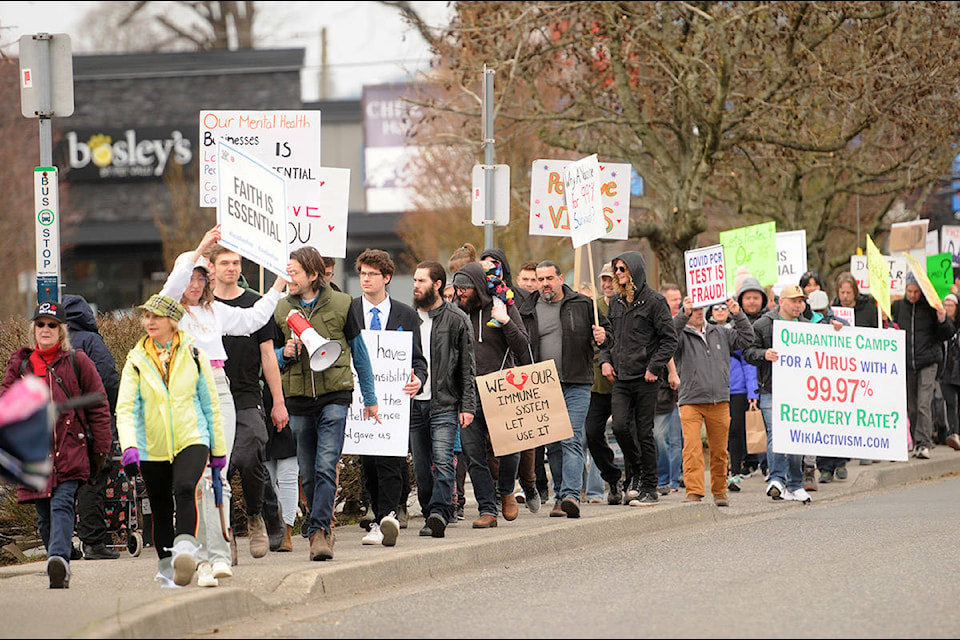 Hundreds of people march along Yale Road near Hodgins Avenue during the Fraser Valley Freedom Rally on Saturday, April 3, 2021. (Jenna Hauck/ Chilliwack Progress)