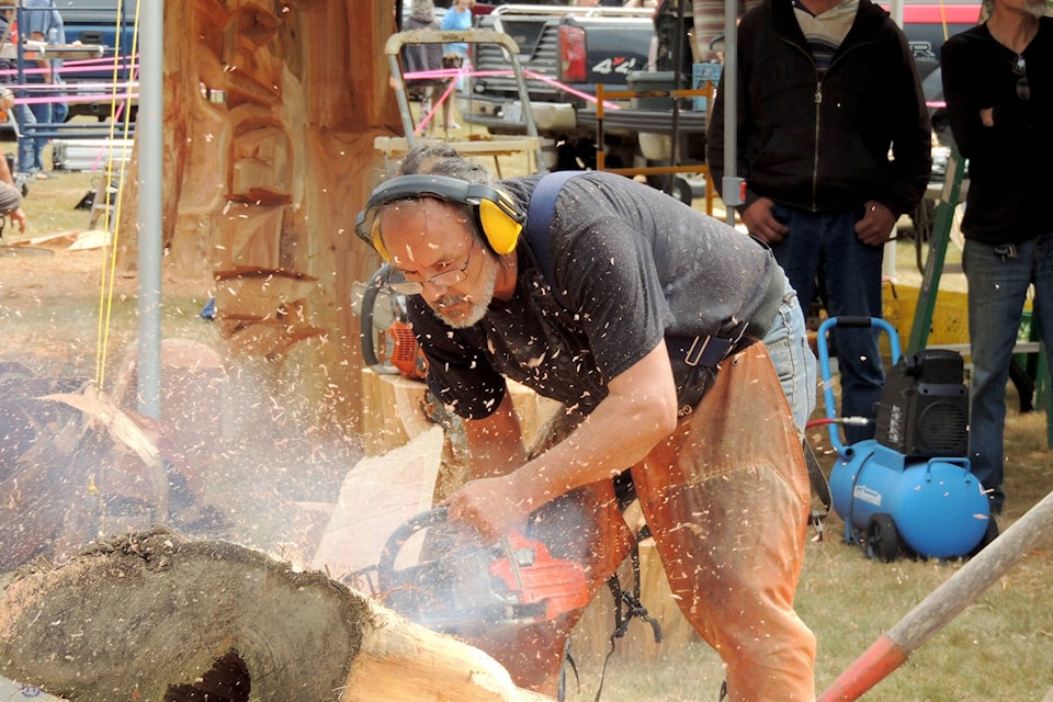 Claude “Rocky” LaRock concentrates as he competes in the speed carving competition at this year’s Hope Chainsaw Carving Competition. (Adam Louis/Observer)