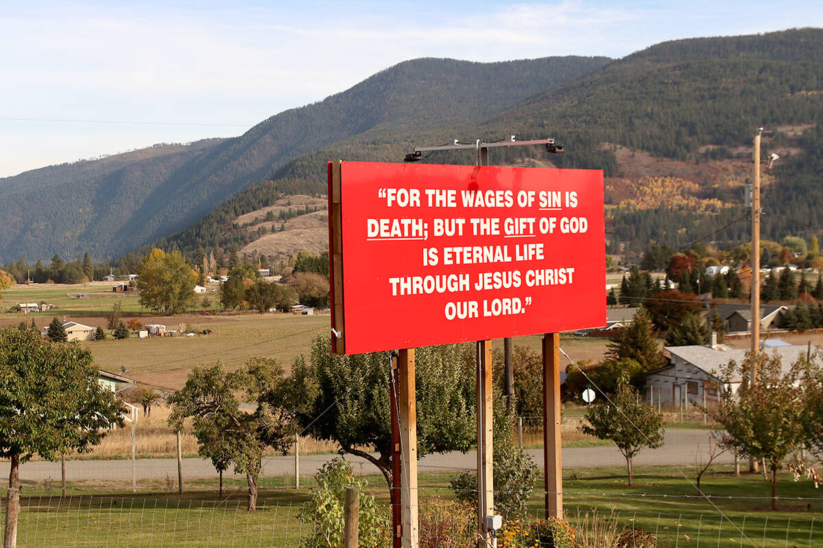 The sign quotes a verse from St. Pauls Letter to the Romans. Photo: Laurie Tritschler