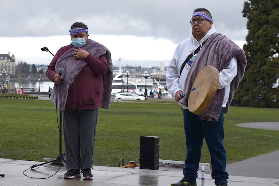 Lavatta Frank and William Pierre Jr. sing Indigenous songs at the legislature steps Thursday morning. (Kiernan Green/News Staff)