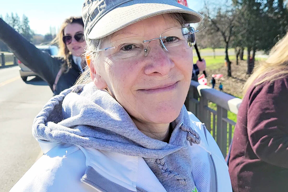 Kim, from Maple Ridge, was one of about two dozen people who took park in a freedom chain anti-vaccine-mandate protest on the 232nd Street overpass in Hwy. 1 in Langley. (Dan Ferguson/Langley Advance Times)