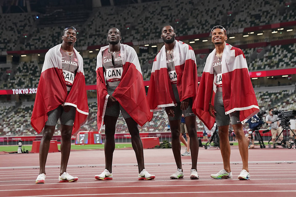 28804057_web1_220414-CPW-Canada-relay-silver-Olympics-team_1