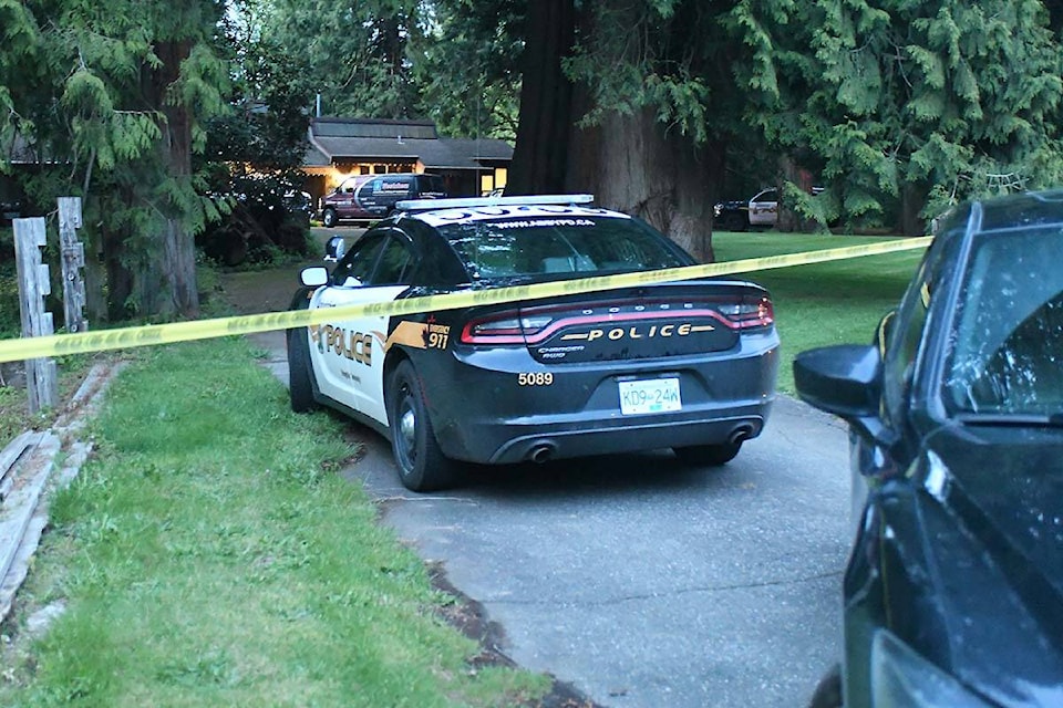 Investigators were on the scene Monday night (May 9) at a house on Arcadian Way in Abbotsford where the bodies of two adults were discovered earlier in the day. (John Morrow/Abbotsford News)
