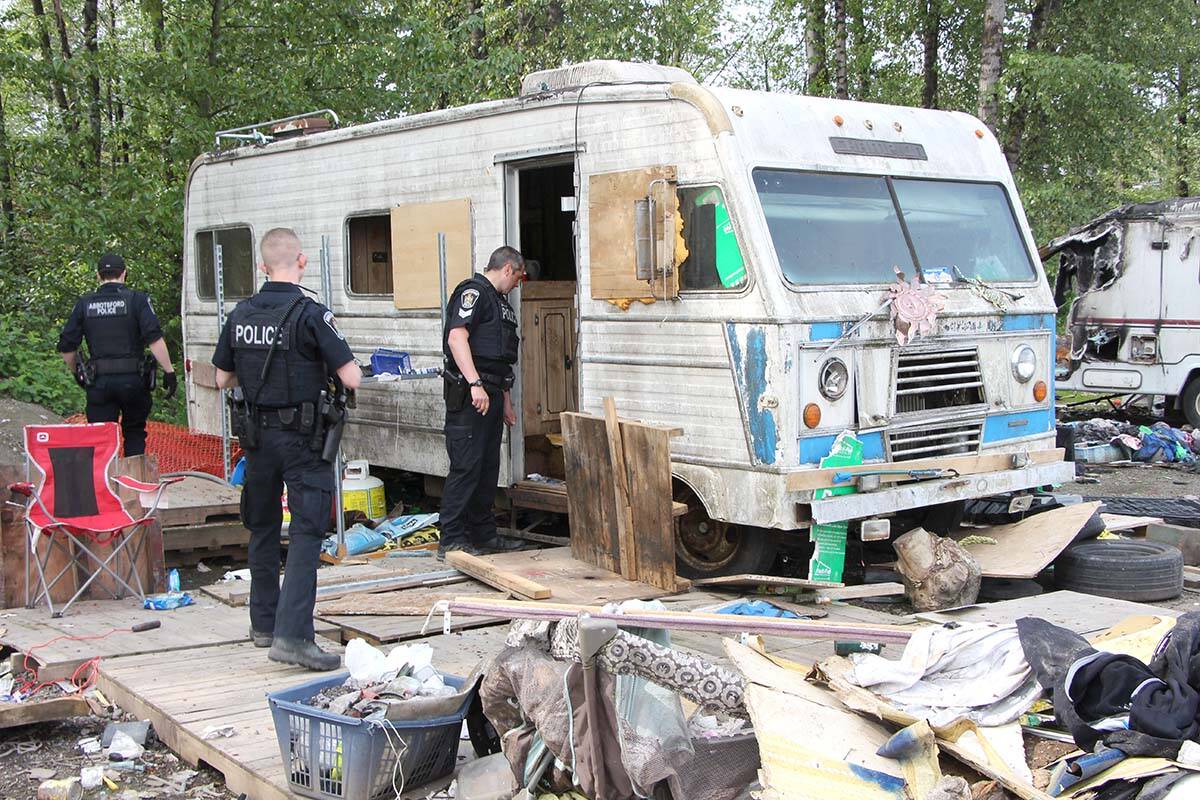 (From left) Abbotsford Police Const. Russell Alleman, Const. Zach Parker and Sgt. Paul Walker check out an RV on May 4, but nobody was in it. (Vikki Hopes/Abbotsford News)