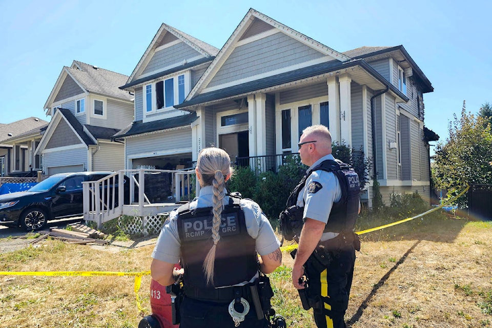 An early morning fire caused extensive damage to a three-storey Aldergrove house in the 27100 block of 35th Avenue Sunday morning, July 23. RCMP taped off the scene. (Dan Ferguson/Langley Advance Times)