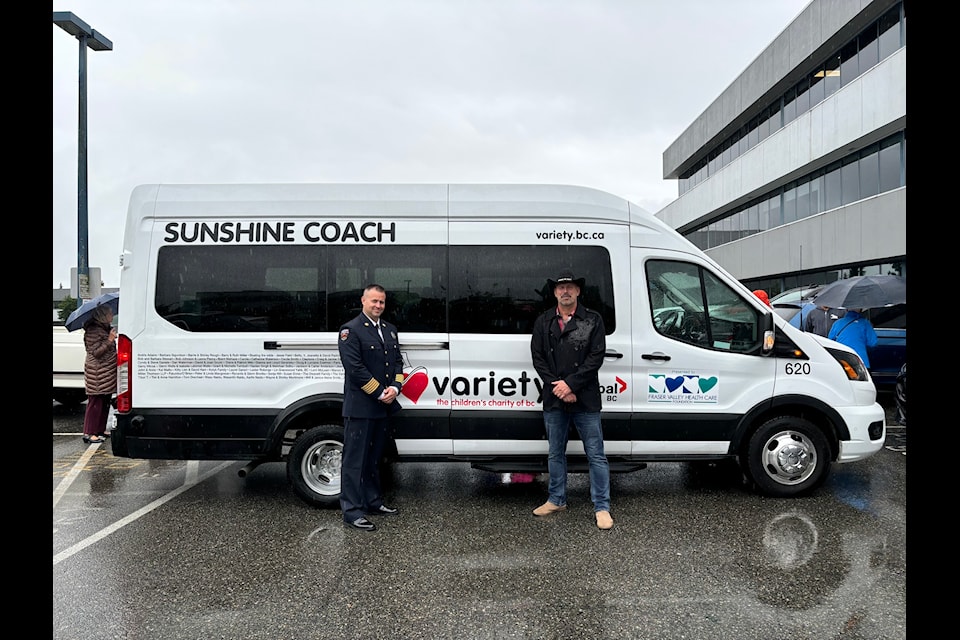 Harrison Fire Chief Curtis Genest (left) and country music artist Todd Richard attended the presentation of a van bought by funds raised during Harrison's Follow Your Heart benefit concert.