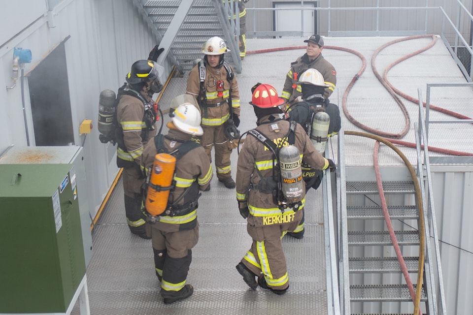 Firefighters gather on an upper floor of Agassiz's new training facility in Agassiz. 