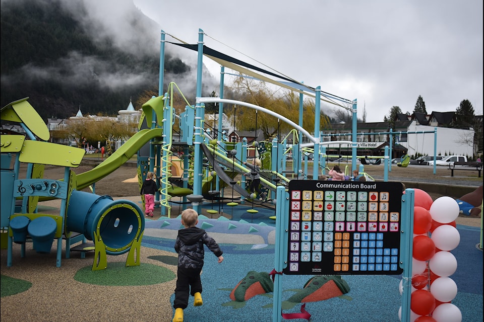 Kids from Harrison Hot Springs Elementary rush to enjoy the village's newest playground, officially opened on Friday, Dec. 20.