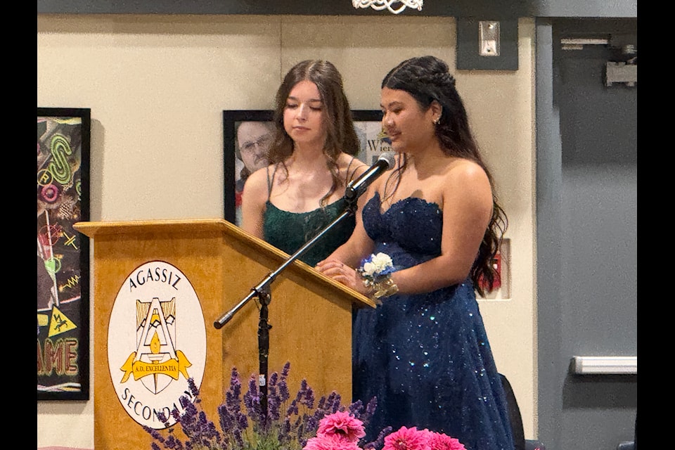 Co-valedictorians Adrinah Byers (left) and Lian Espiritu address the class of 2025.