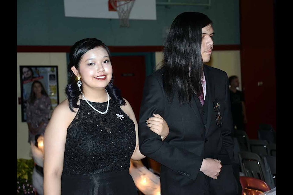 Anastasia Modeste-Point and Brandon Point glide into the gym for the AESS graduation ceremony. (Nina Grossman/The Observer)