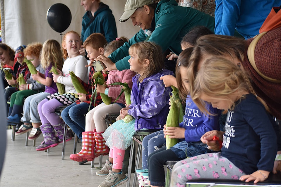The under six division gets ready for the corn husking competition at the Agassiz Fall Fair. (Grace Kennedy/The Observer)
