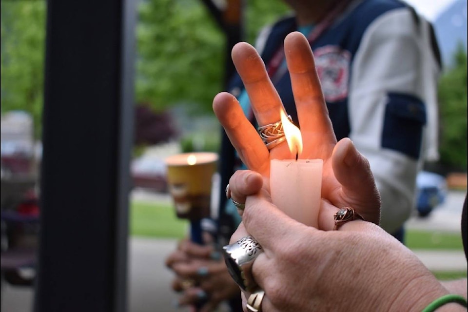 A candle lit for April Parisian at a candlelight vigil Saturday, May 23 in Memorial Park. (Emelie Peacock/Hope Standard)