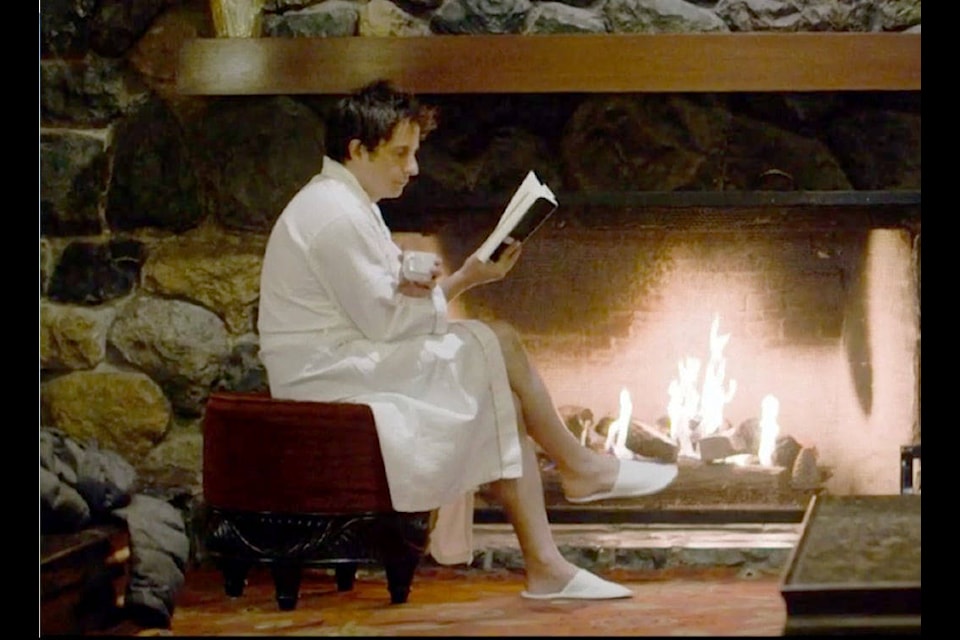 Jonny Harris reads through a book at Harrison Hot Springs resort during the Harrison ‘Still Standing’ episode. The episode aired again on Sunday, July 5. (Screenshot/Still Standing)