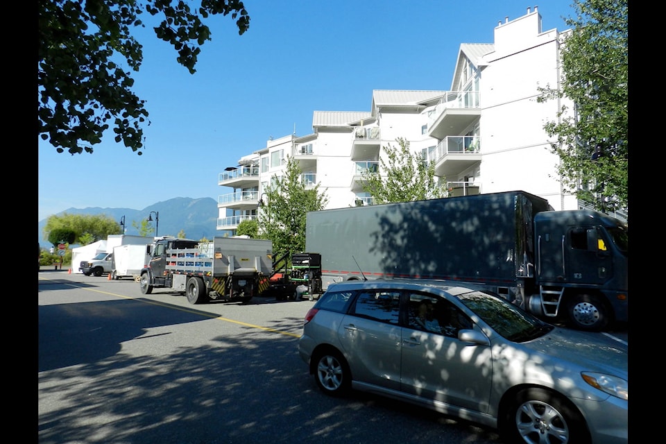 Film production trucks are parked along the side of the road in Harrison Hot Springs on Monday afternoon. The Hallmark movie “Neverbrides” is being filmed in part in Harrison. (Adam Louis/Observer)