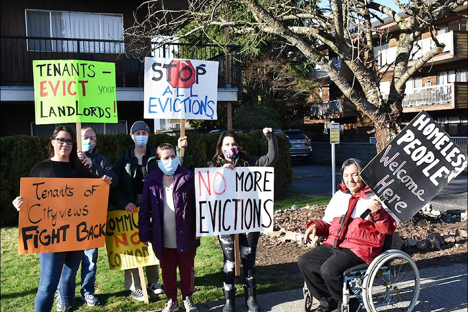 Ralliers gather in front of the Cityviews Village apartment building in Maple Ridge to protest attempts to evict low-income tenants by the building owner. (Ronan O’Doherty - The News)
