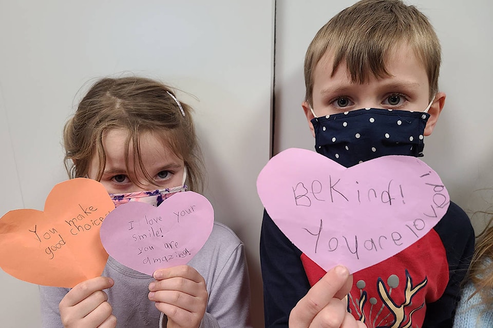 Avery and Eli holding some of the kindness hearts posted around Agassiz Christian School. (Melanie Victor/Contributed)