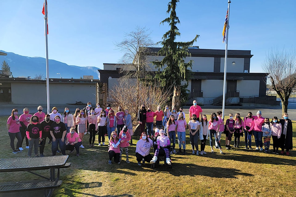 The students and staff at AESS in their pink shirts, in support of anti-bullying on Pink Shirt Day (Feb. 24, 2021). (AESS/Contributed)