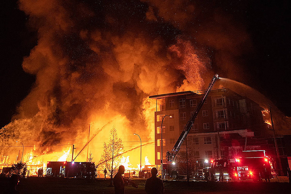 Fire consumed a condo development project under construction at 208th Street and 80th Avenue Monday night. Many spectators shared their images. (Daniel Gerstner/Instagram: @gerstner/Special to Langley Advance Times)