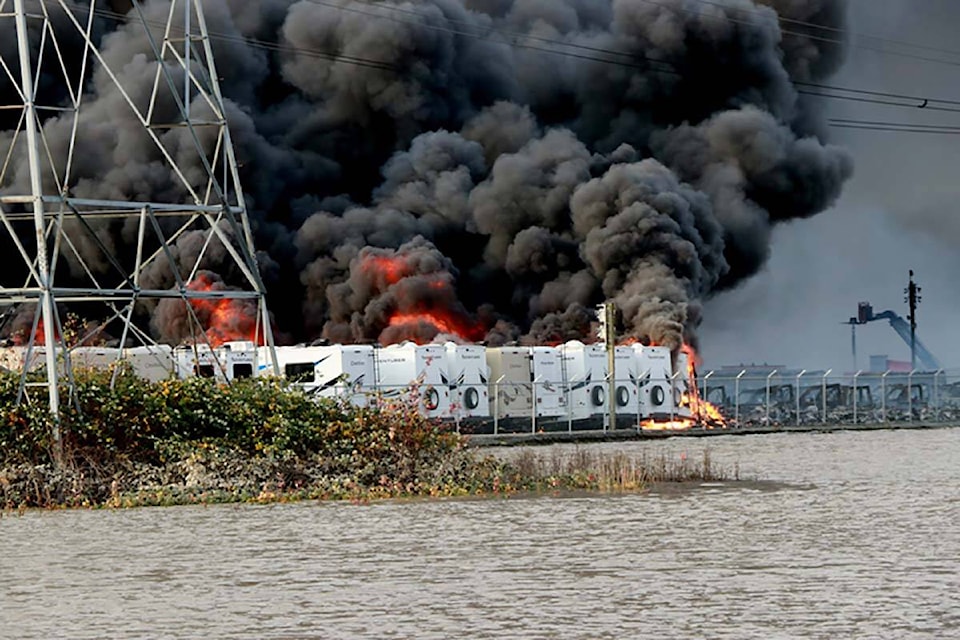 Thick black smoke fills the air at a massive fire at the Fraserway RV holding centre near Highway 1 east of Whatcom Road on Wednesday, Nov. 17, 2021. (Black Press Media photo)